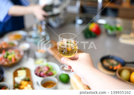 A toast at the table and with a glass. A toast at the table and with a glass. 139935102
