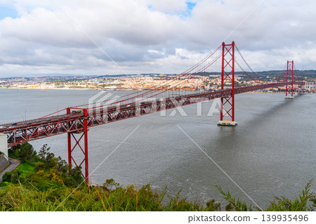 Suspension bridge over Tagus River in Lisbon cityscape Suspension bridge over Tagus River in Lisbon cityscape 139935496