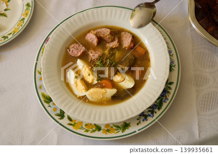Traditional Meat Soup with Sausage Eggs and Vegetables Traditional Meat Soup with Sausage Eggs and Vegetables 139935661