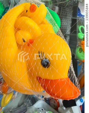 Colorful rubber duck family ready for summer fun at the toy store Colorful rubber duck family ready for summer fun at the toy store 139935844