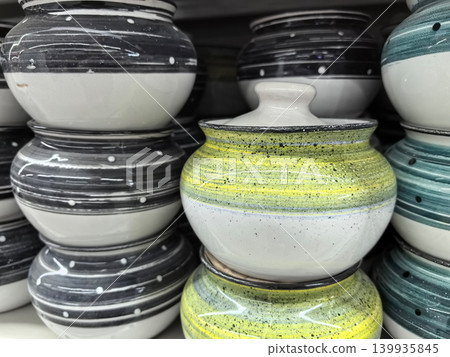 Ceramic bowls in vibrant colors and patterns create an artistic display Ceramic bowls in vibrant colors and patterns create an artistic display 139935845