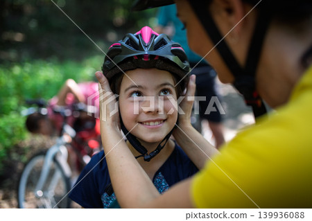 Active family enjoying biking adventure in scenic landscape. Active family enjoying biking adventure in scenic landscape. 139936088