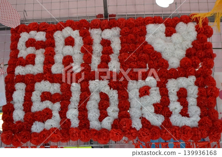 Red and white floral sign spelling san isidro for feria san isidro madrid festival decoration and market display background 139936168