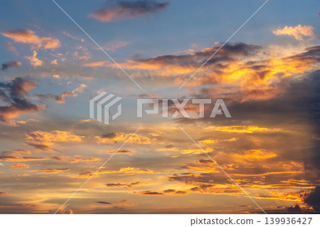 The summer sunset sky and clouds are vividly colored. The summer sunset sky and clouds are vividly colored. 139936427