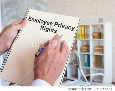 Employee privacy rights document in an office for workplace compliance. Employee privacy rights document in an office for workplace compliance. 139936585