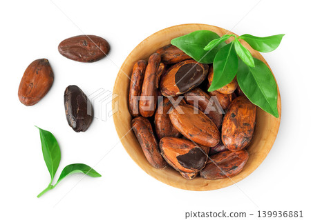 cocoa beans in wooden bowl isolated on white background. Top view. Flat lay cocoa beans in wooden bowl isolated on white background. Top view. Flat lay 139936881