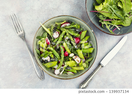 Green detox salad with asparagus radish and seeds Green detox salad with asparagus radish and seeds 139937134