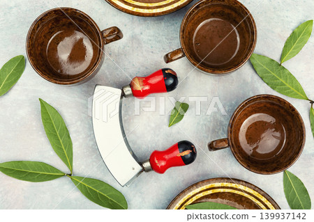 herbal tea concept with bay leaves and cups herbal tea concept with bay leaves and cups 139937142