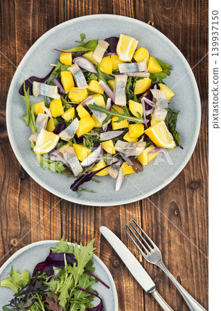 Traditional herring and potato salad with onion Traditional herring and potato salad with onion 139937150