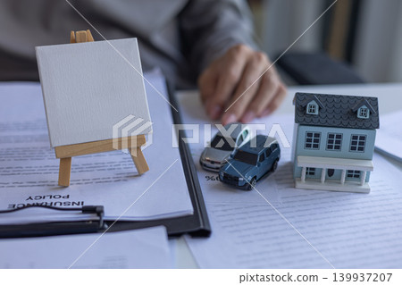 Blank Canvas for Your Copy Space with House and Toy Cars for Insurance Branding or Text Blank Canvas for Your Copy Space with House and Toy Cars for Insurance Branding or Text 139937207