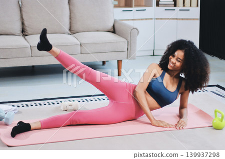 Women exercising in fitness studio yoga classes Women exercising in fitness studio yoga classes 139937298