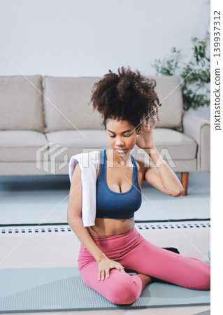 Women exercising in fitness studio yoga classes Women exercising in fitness studio yoga classes 139937312
