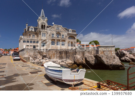 Historic waterfront mansion and fishing boat in Cascais Portugal Historic waterfront mansion and fishing boat in Cascais Portugal 139937680