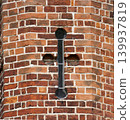 Red brick wall texture with black metal anchor plate 139937819