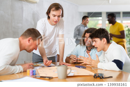 Group of men play board games 139938161