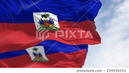 Haiti national flags waving in the wind on a clear day Haiti national flags waving in the wind on a clear day 139938201