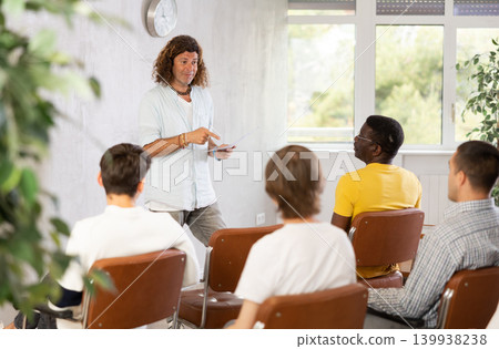 European man leads a lecture during a meeting European man leads a lecture during a meeting 139938238