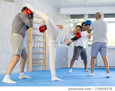 Opponent punches enemy with his feet and hands, using all his strength, courage, and courage 139938376
