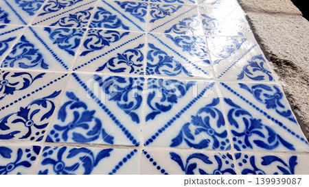 Perspective View of Traditional Cobalt Blue and White Azulejo Tiles with Reflective Glaze Perspective View of Traditional Cobalt Blue and White Azulejo Tiles with Reflective Glaze 139939087