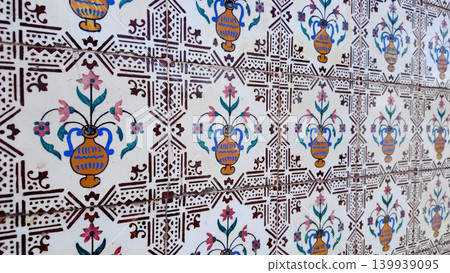 Traditional Portuguese azulejo tiles with painted vase and floral patterns Traditional Portuguese azulejo tiles with painted vase and floral patterns 139939095