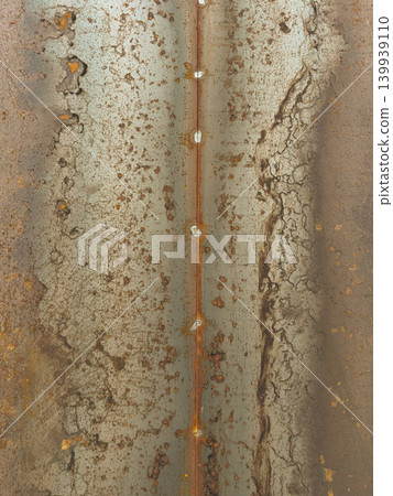 Rusted Steel Plate with Vertical Weld Seam and Heavy Oxidation Patterns Rusted Steel Plate with Vertical Weld Seam and Heavy Oxidation Patterns 139939110