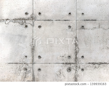 Industrial Weathered Exposed Concrete Wall with Tie Rod Holes Industrial Weathered Exposed Concrete Wall with Tie Rod Holes 139939163