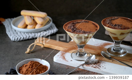 Classic Tiramisu Dessert Served in Elegant stemmed cocktail Glasses Classic Tiramisu Dessert Served in Elegant stemmed cocktail Glasses 139939187