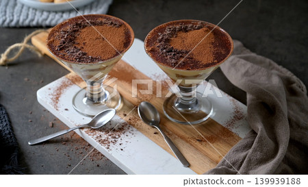 Two Glasses of Tiramisu Topped with Cocoa Powder and Shaved Chocolate Two Glasses of Tiramisu Topped with Cocoa Powder and Shaved Chocolate 139939188