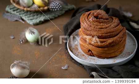 Gourmet Cinnamon Roll with Easter Table Setting and Spring Decor 139939194