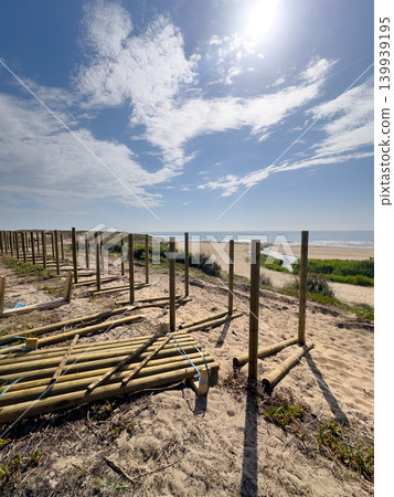 Wooden boardwalk construction along the coastline of Praia de Bocamar Wooden boardwalk construction along the coastline of Praia de Bocamar 139939195