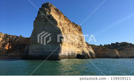 Towering Limestone Sea Stack on the Coast of Algarve Portugal Towering Limestone Sea Stack on the Coast of Algarve Portugal 139939521