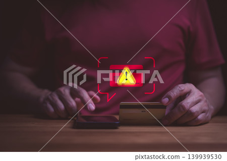 Credit card fraud alert and cyber security concept. User on smartphone with online payment scam warning. Phishing, identity theft, hacked banking account, and data protection risk. Credit card fraud alert and cyber security concept. User on smartphone with online payment scam warning. Phishing, identity theft, hacked banking account, and data protection risk. 139939530