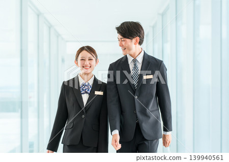 Young Asian businesspeople in suits (hotel staff, planners, bankers, consultants) Young Asian businesspeople in suits (hotel staff, planners, bankers, consultants) 139940561