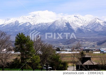 The Tokachi Mountain Range as seen from Nakafurano Town, Hokkaido [April] 139941421