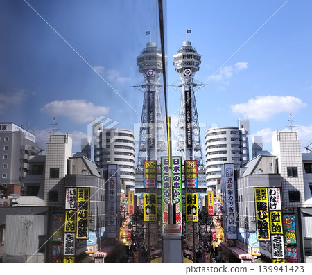 A landscape where two Tsutenkaku towers are reflected in the water. A landscape where two Tsutenkaku towers are reflected in the water. 139941423