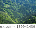 A beautiful mountain range enveloped in vibrant new greenery, photographed from the Shikoku Karst. 139941439
