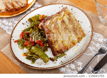 Dish of pork ribs with stewed green beans close up Dish of pork ribs with stewed green beans close up 139941705