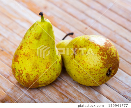 Juicy pear fruits served to table 139941777