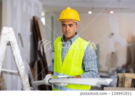 Repairman working in construction site in apartment 139941851