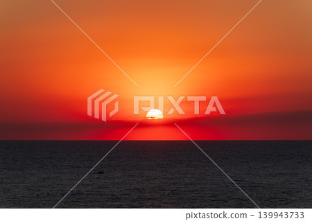 Beautiful red and orange sunrise over the sea. Beautiful red and orange sunrise over the sea. 139943733