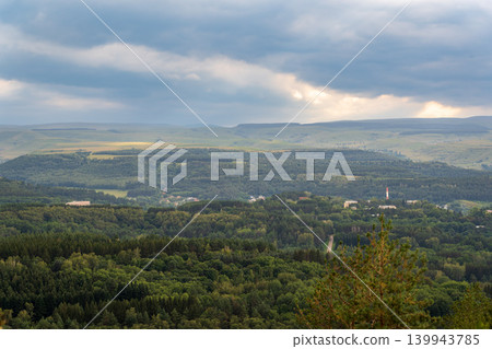 Layers of green mountains and hills in the haze during sunset. Panoramic View of Green hills and Meadow. Layers of green mountains and hills in the haze during sunset. Panoramic View of Green hills and Meadow. 139943785