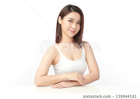 A beautiful young Asian woman with clean, fresh skin against a white background. Skincare, facial treatment, cosmetology, beauty, and spa. An elegant portrait of an Asian woman. A beautiful young Asian woman with clean, fresh skin against a white background. Skincare, facial treatment, cosmetology, beauty, and spa. An elegant portrait of an Asian woman. 139944181