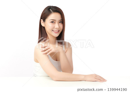 A beautiful young Asian woman with clean, fresh skin against a white background. Skincare, facial treatment, cosmetology, beauty, and spa. An elegant portrait of an Asian woman. 139944190