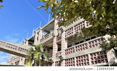 The unique concrete architecture of Nago City Hall in Okinawa Prefecture and the blue sky The unique concrete architecture of Nago City Hall in Okinawa Prefecture and the blue sky 139944394