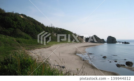 A clear blue sky, a calm sea, white sandy beaches, and green capes. A clear blue sky, a calm sea, white sandy beaches, and green capes. 139944812