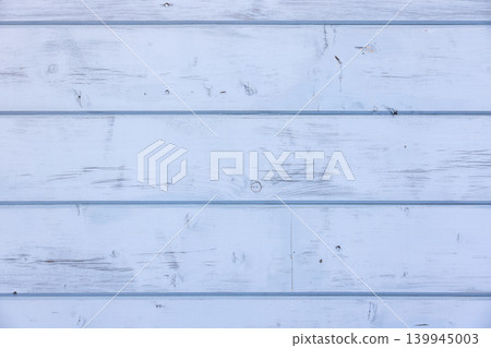 Light blue wooden wall with knots and cracks, front view Light blue wooden wall with knots and cracks, front view 139945003
