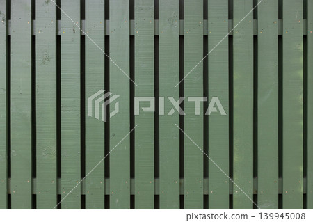 Wooden fence background texture, green vertical planks Wooden fence background texture, green vertical planks 139945008