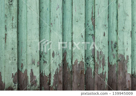 Texture of weathered wooden wall with green peeling paint Texture of weathered wooden wall with green peeling paint 139945009