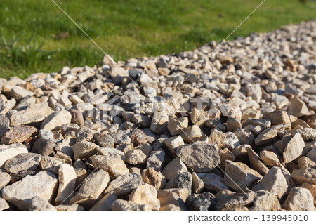 Close-up view of light-colored gravel and rocks used for landscaping Close-up view of light-colored gravel and rocks used for landscaping 139945010