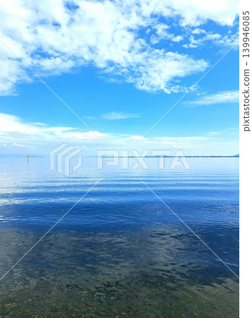 A still, mirror-like surface of water A still, mirror-like surface of water 139946085